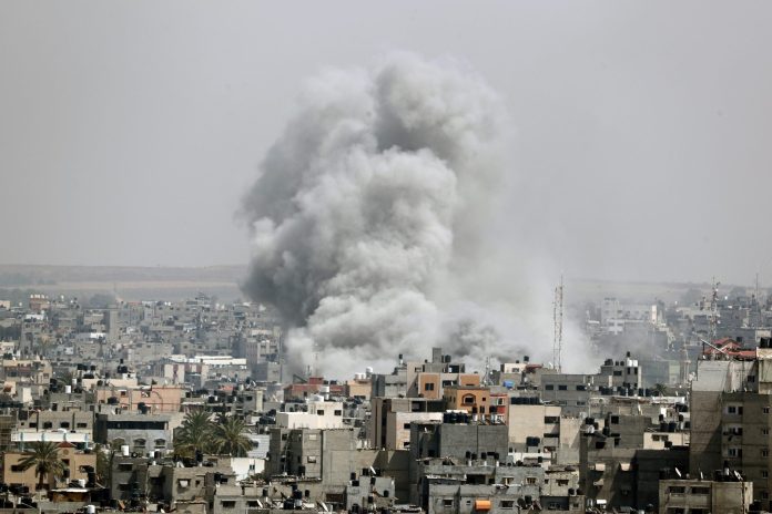 Smoke rises following an Israeli air strike in Gaza